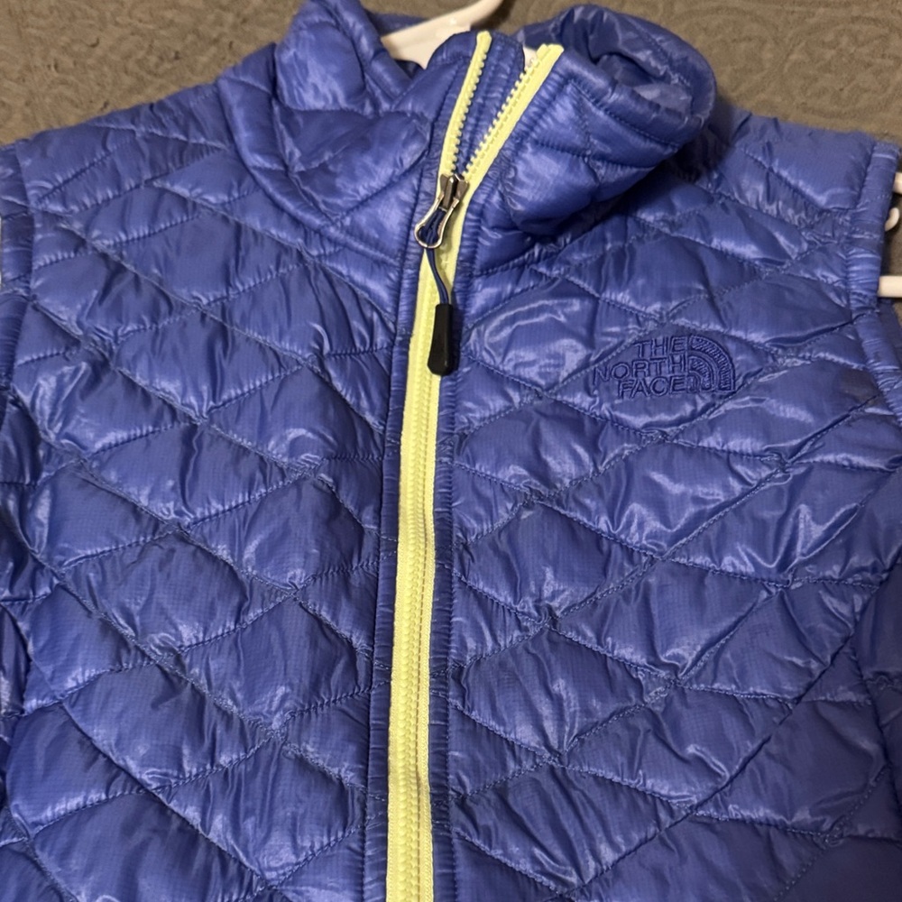 The North Face Purple Quilted Vest with Yellow Zipper